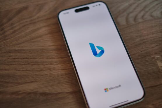 Smartphone displaying the Bing logo, representing the importance of managing your business presence on platforms like Bing, Apple Maps, and Yelp to reach more customers across search engines.
