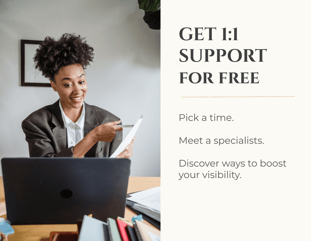 Woman smiling and pointing at a document during a video call, with text offering free 1:1 support to boost visibility and meet a specialist.